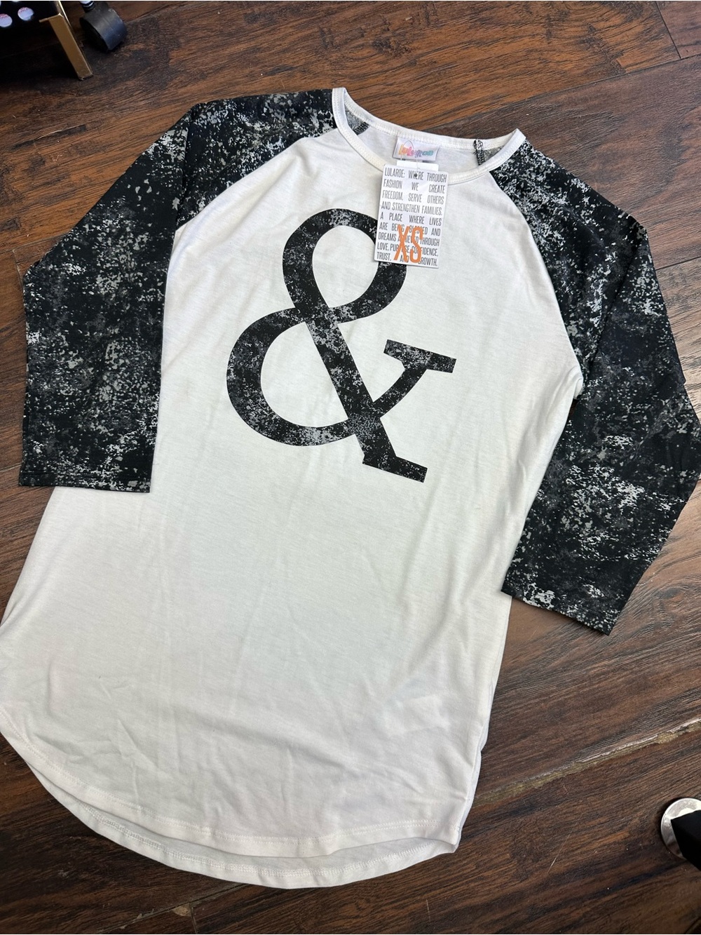 NWT LuLaRoe Randy Shirt- “Cutie”- White w/black Sleeves. XS